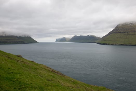 Typical landscape on the Faroe Islands, with Kalsoyarfjørdur, the fjord between kalsoy and kunoy