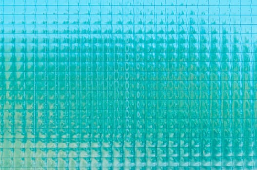 Old light blue glass vintage background, textured