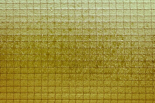 Old light yellowish-brown glass vintage background, textured