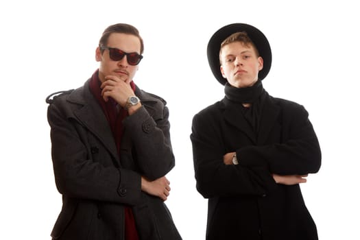 Two young adults wearing formal dress on white background