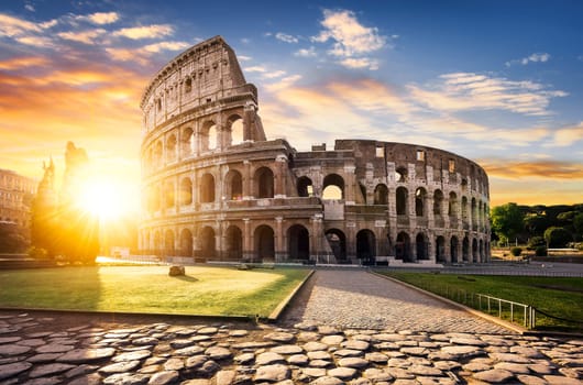 View of Colosseum in Rome and morning sun, Italy, Europe.