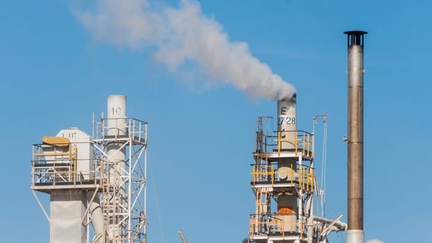 White smoke in the blue sky
