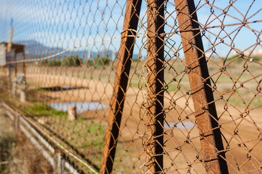 Rusted wire netting in industrial place