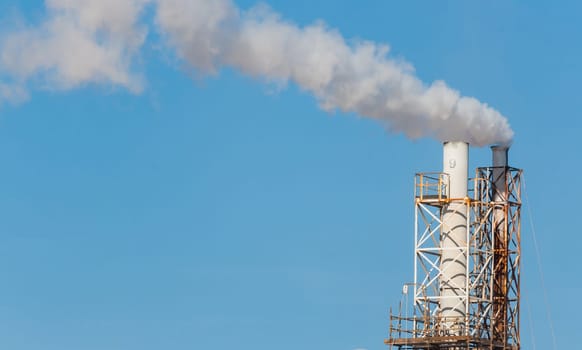 White smoke in the blue sky