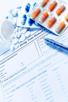 Syringe with glass vials and medications pills drug on white