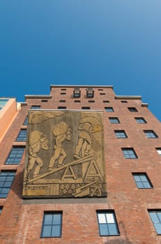 restored factory building with a remembrance of its industrial past in the dusseldorf media harbor. The Hafen district contains some spectacular post-modern architecture, but also some bars, restaurants and pubs, which makes it a prominent lifestyle district