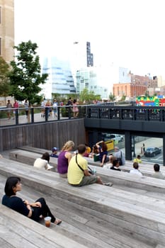 NEW YORK CITY - SEPTEMBER 03: People at High Line Park in NYC on September 03th, 2013. The High Line is a public park built on an historic freight rail line elevated above the streets on Manhattan West Side.