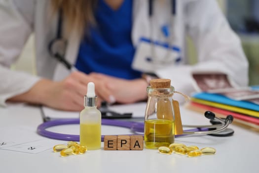 A healthcare professional rigorously examines various herbal oils and supplements for patient care and wellbeing