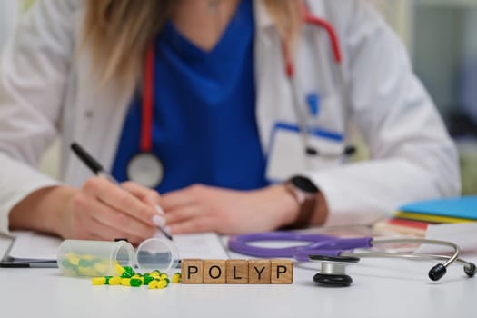 A healthcare provider records important information while a stethoscope and prescription medicines are visible
