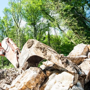 Excavator with big shovel to work with rocks