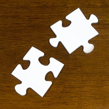 puzzle pieces on wood table