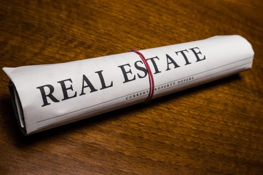 real estate newspaper on desk