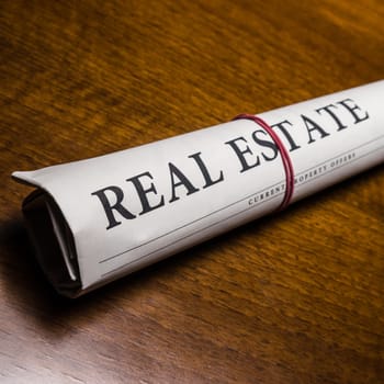 real estate newspaper on desk