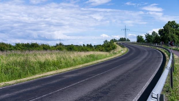 curvy road in landscape in summer