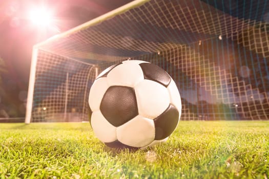 soccer ball near goal and lensflare