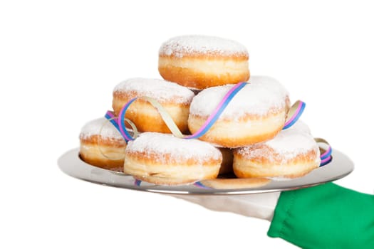 clown is holding biscuits on tray