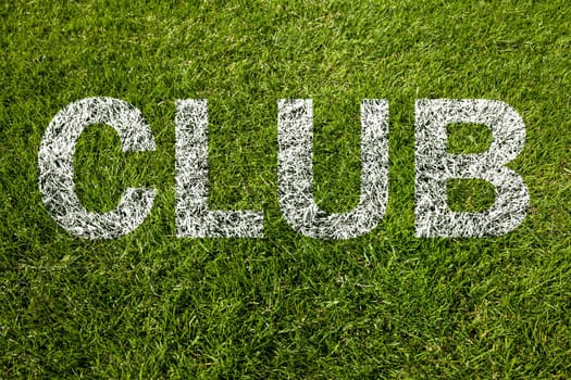 club text on green grass