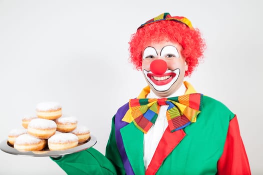 clown withe biscuits on tray on white