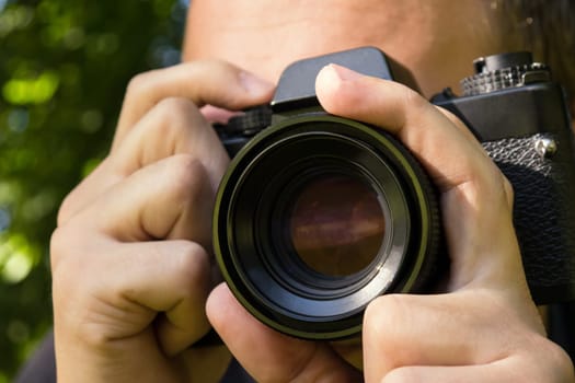 photographer with camera outdoor