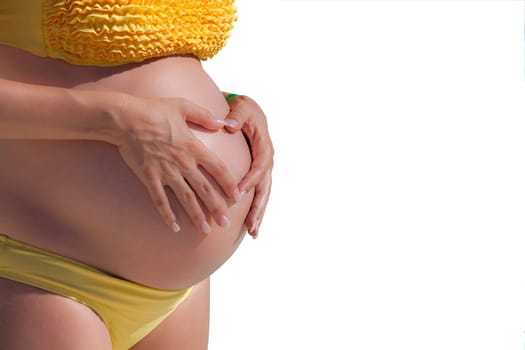 Pregnant woman with hands over tummy at white background