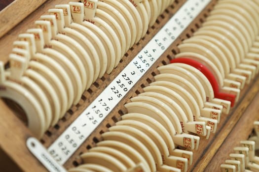 Optician with set of trial frames and trial lenses