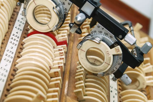 optician with set of trial frames and trial lenses