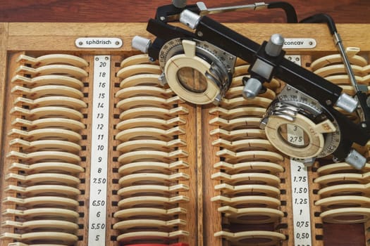 optician with set of trial frames and trial lenses
