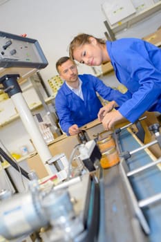 Two workers on production line