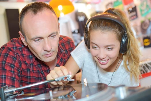 Girl playing a vinyl record