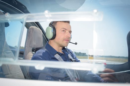 Side view of pilot in aircraft
