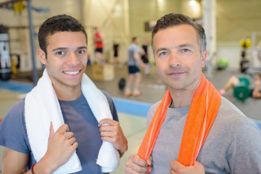 men in the gym with towel