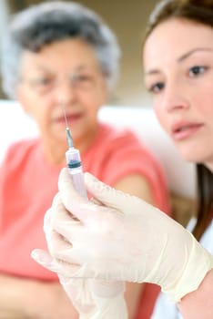 Senior woman getting a flu jab