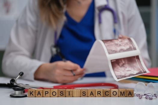 A dedicated healthcare professional is reviewing and analyzing Kaposi Sarcoma images in a clinical setting