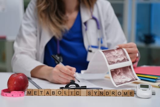 A healthcare professional examines metabolic syndrome using visual aids and tools for better understanding