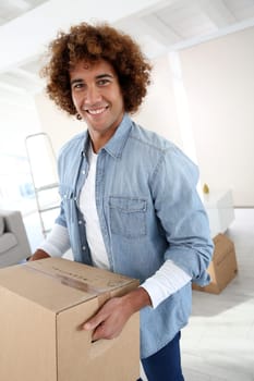 Man holding box as moving in new place