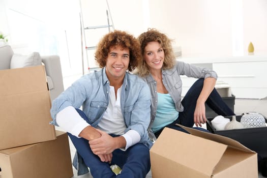 Couple getting in their new apartment to live together
