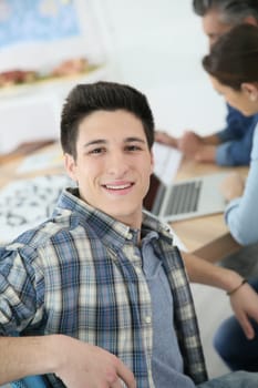 Portrait of college boy attending class