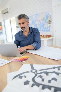 Porrtait of smiling architect in office