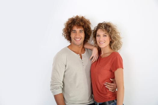 Attractive couple standing on white background
