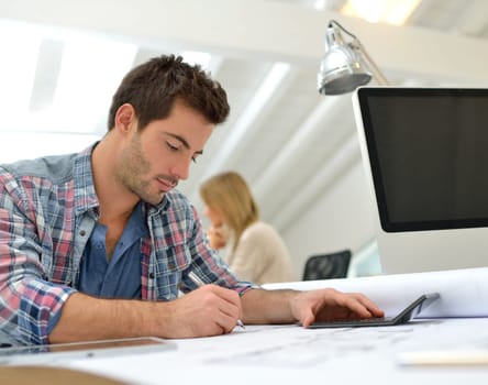 Architect working on construction budget