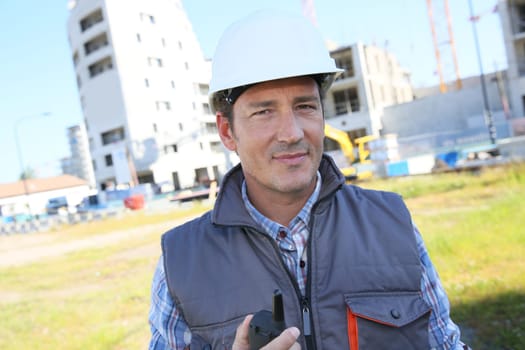 Portrait of entrepreneur on building site