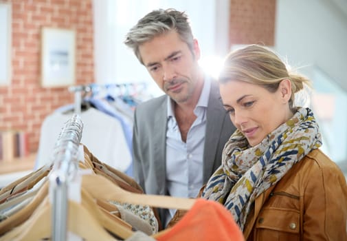 Mature couple shopping in clothing store