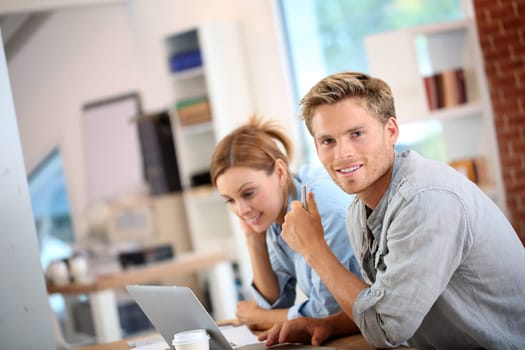Students working on laptop computer