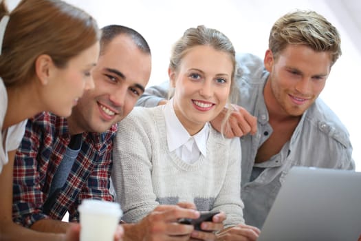 Group of students using laptop computer