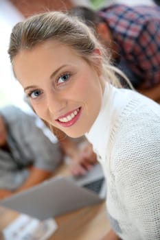 Portrait of student girl, friends in background