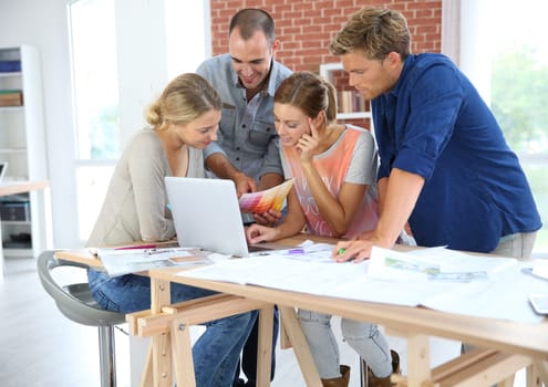 Students in architecture working together on project