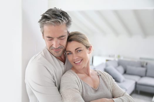 Portrait of mature couple relaxing at home