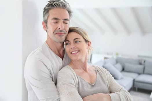 Portrait of mature couple relaxing at home