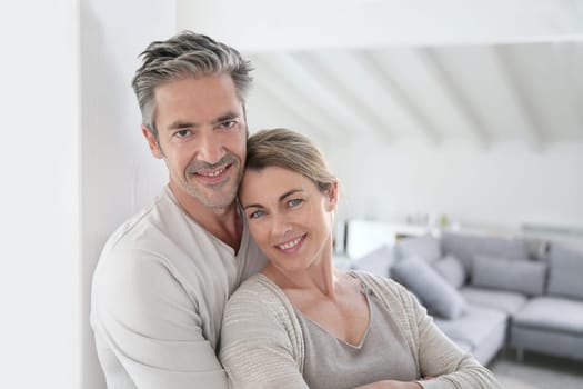 Portrait of mature couple relaxing at home