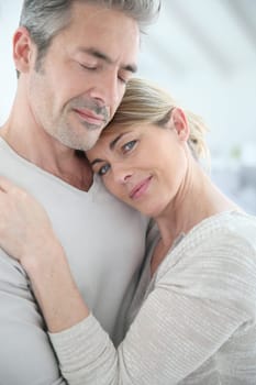 Mature couple embracing with love and tenderness